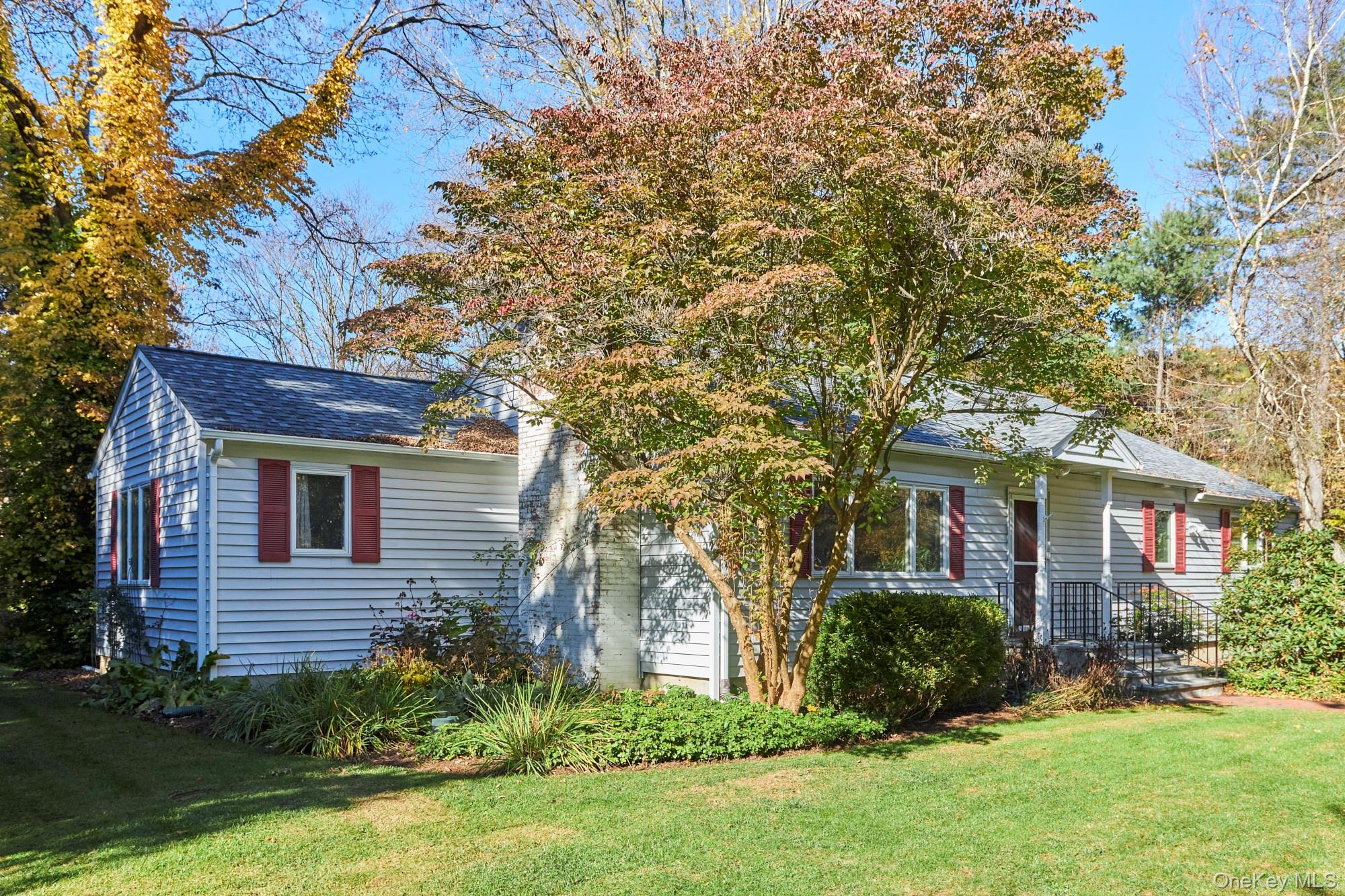 2467 Salt Point Turnpike Clinton Corners, NY 12514 - Photo 1 of 21 a front view of a house with a yard and trees
