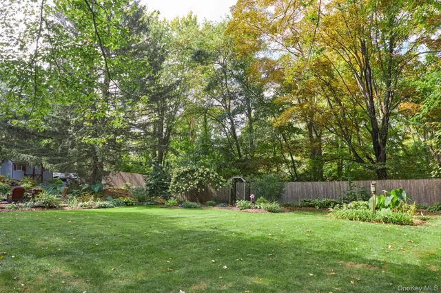 a backyard of a house with lots of green space