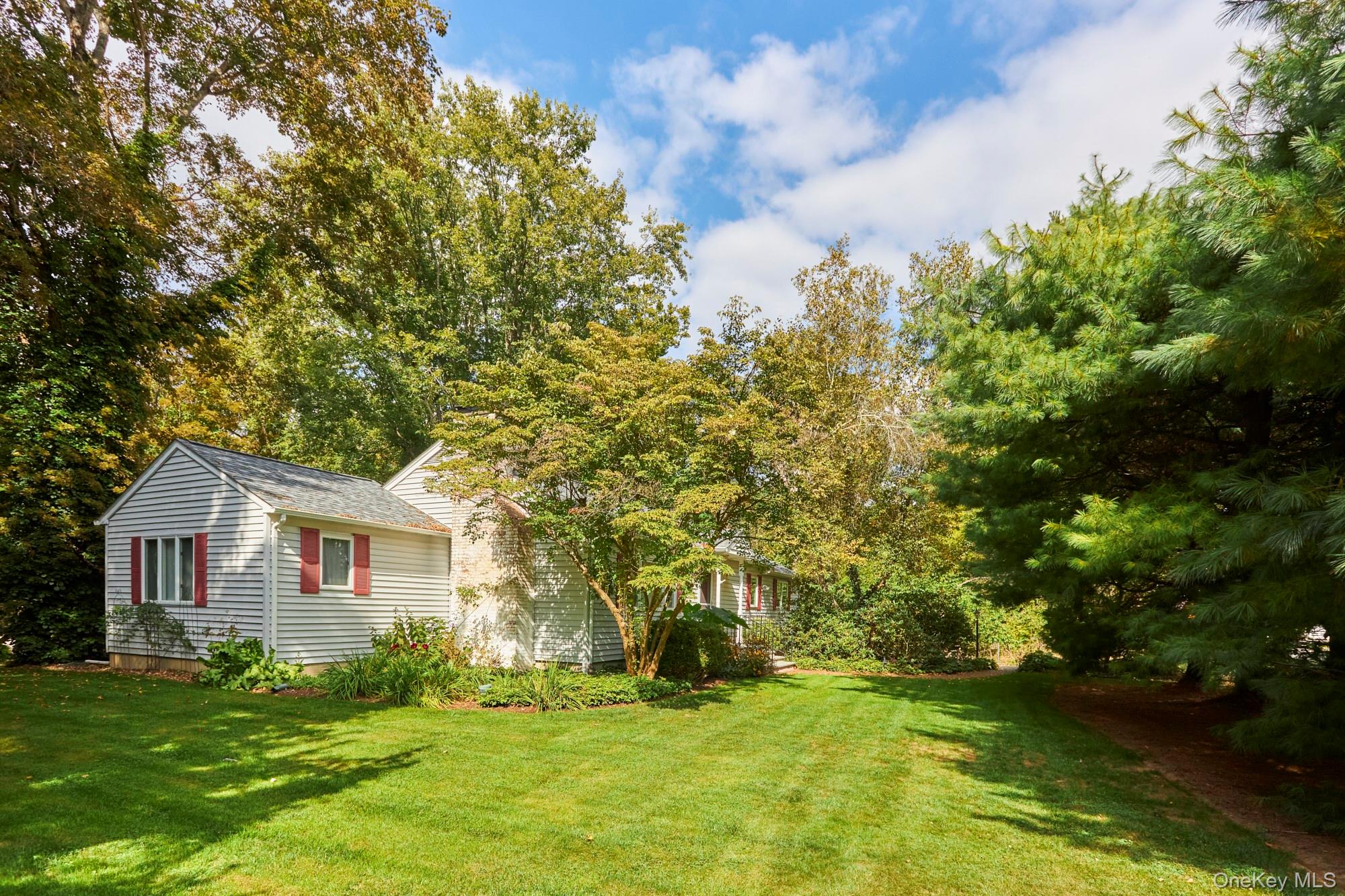 2467 Salt Point Turnpike Clinton Corners, NY 12514 - Photo 19 of 21 a front view of a house with a garden