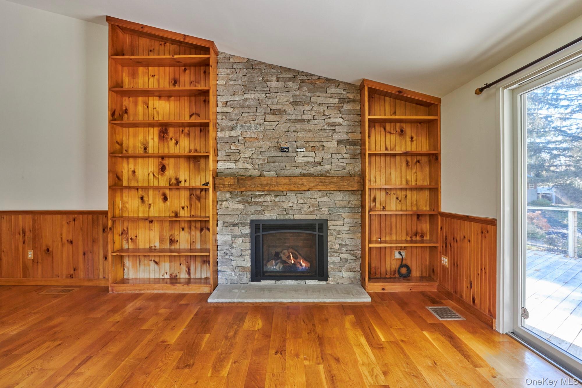 2467 Salt Point Turnpike Clinton Corners, NY 12514 - Photo 3 of 21 a view of an empty room with a fireplace and a window