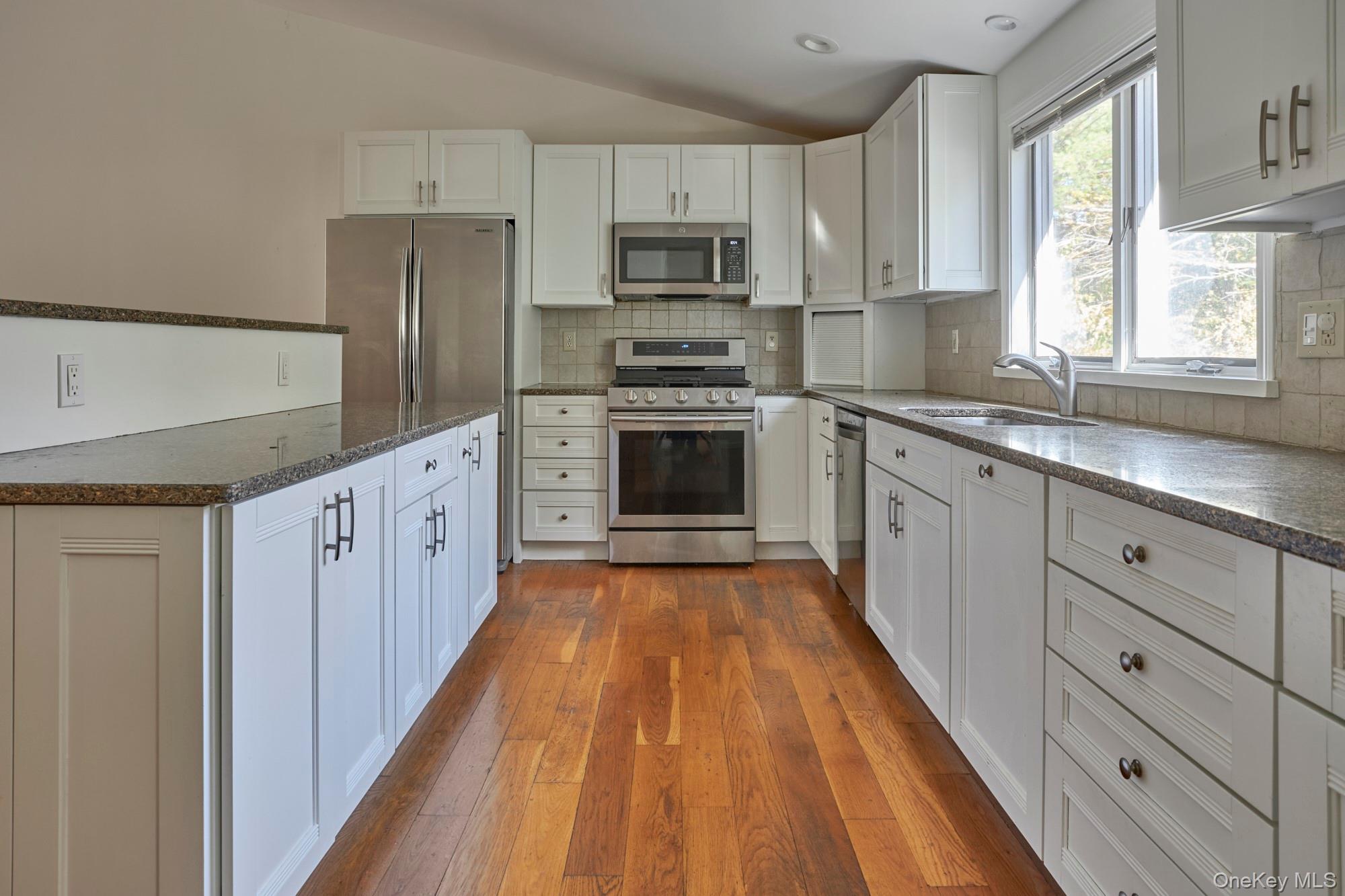 2467 Salt Point Turnpike Clinton Corners, NY 12514 - Photo 4 of 21 a kitchen with cabinets a sink and steel appliances