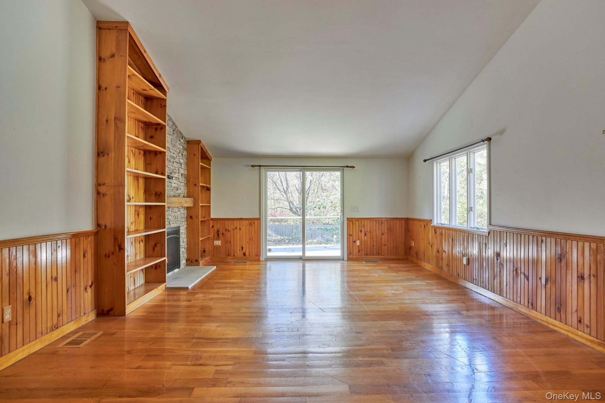 2467 Salt Point Turnpike Clinton Corners, NY 12514 - Photo 7 of 21 a view of an empty room with wooden floor and windows