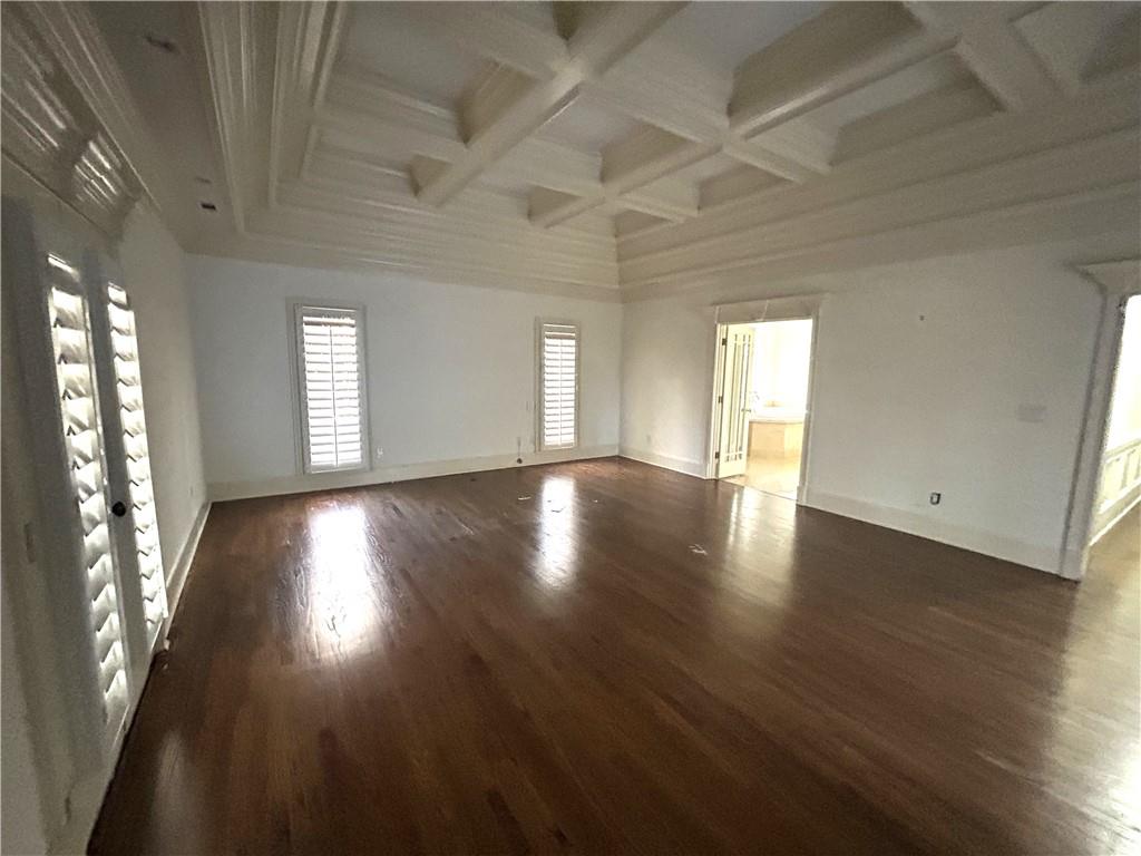 13039 Freemanville Road Alpharetta, GA 30004 - Photo 12 of 28 an empty room with wooden floor and windows
