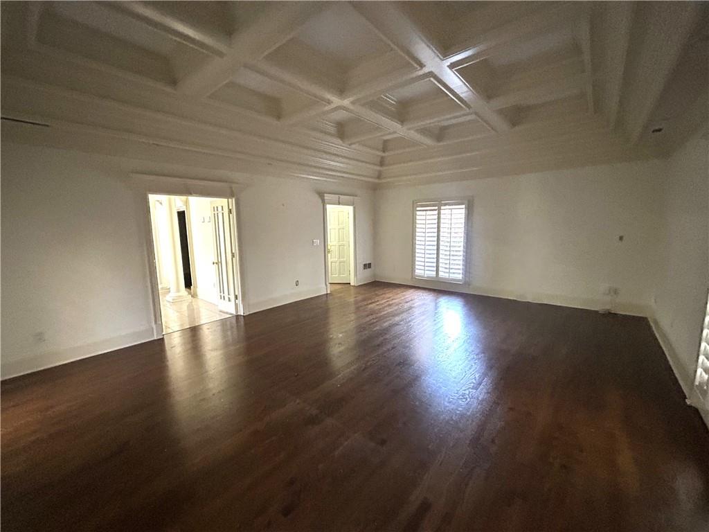 13039 Freemanville Road Alpharetta, GA 30004 - Photo 13 of 28 an empty room with wooden floor and windows