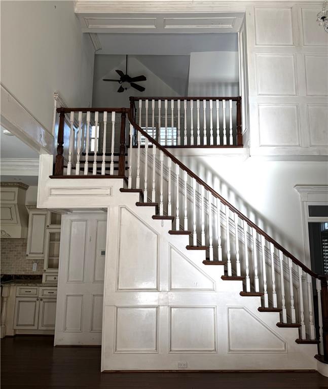 13039 Freemanville Road Alpharetta, GA 30004 - Photo 24 of 28 a view of staircase with white walls and a window