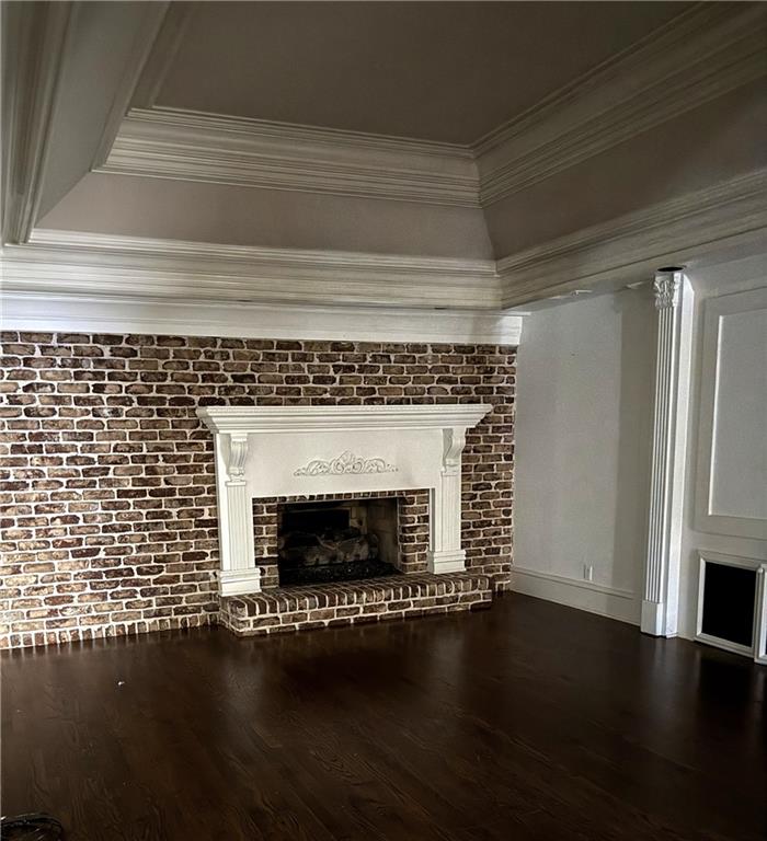 13039 Freemanville Road Alpharetta, GA 30004 - Photo 26 of 28 a view of a livingroom with wooden floor a fireplace and a window