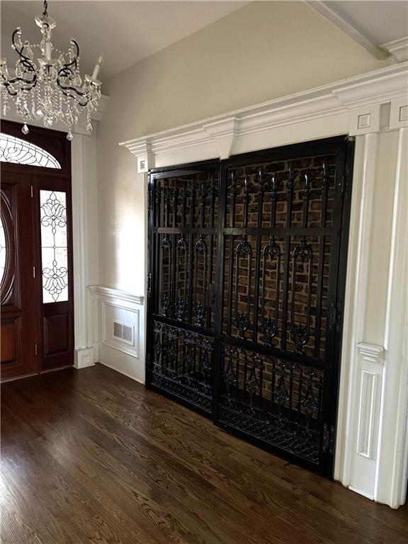 13039 Freemanville Road Alpharetta, GA 30004 - Photo 7 of 28 a view of a hallway with wooden floor and staircase