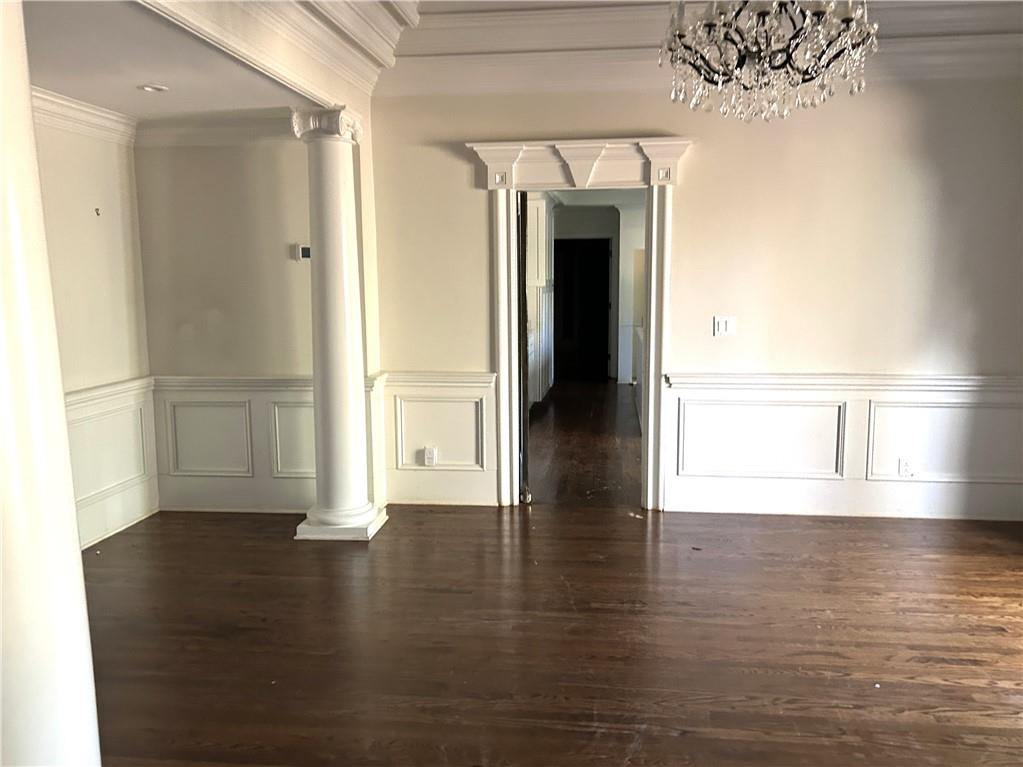 13039 Freemanville Road Alpharetta, GA 30004 - Photo 8 of 28 a view of empty room with wooden floor and fan