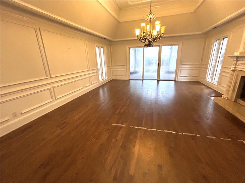 13039 Freemanville Road Alpharetta, GA 30004 - Photo 9 of 28 a view of a room with wooden floor and large windows