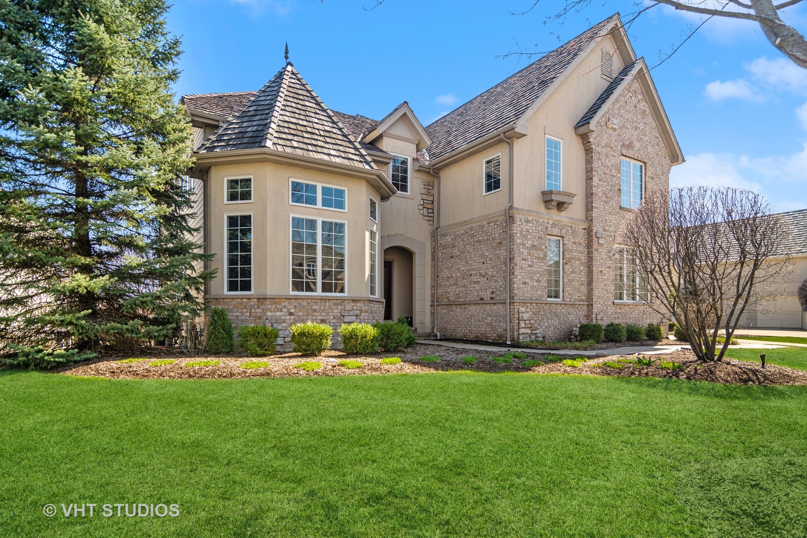1015 Ridgeview Drive Inverness, IL 60010 - Photo 1 of 29 a front view of a house with a garden
