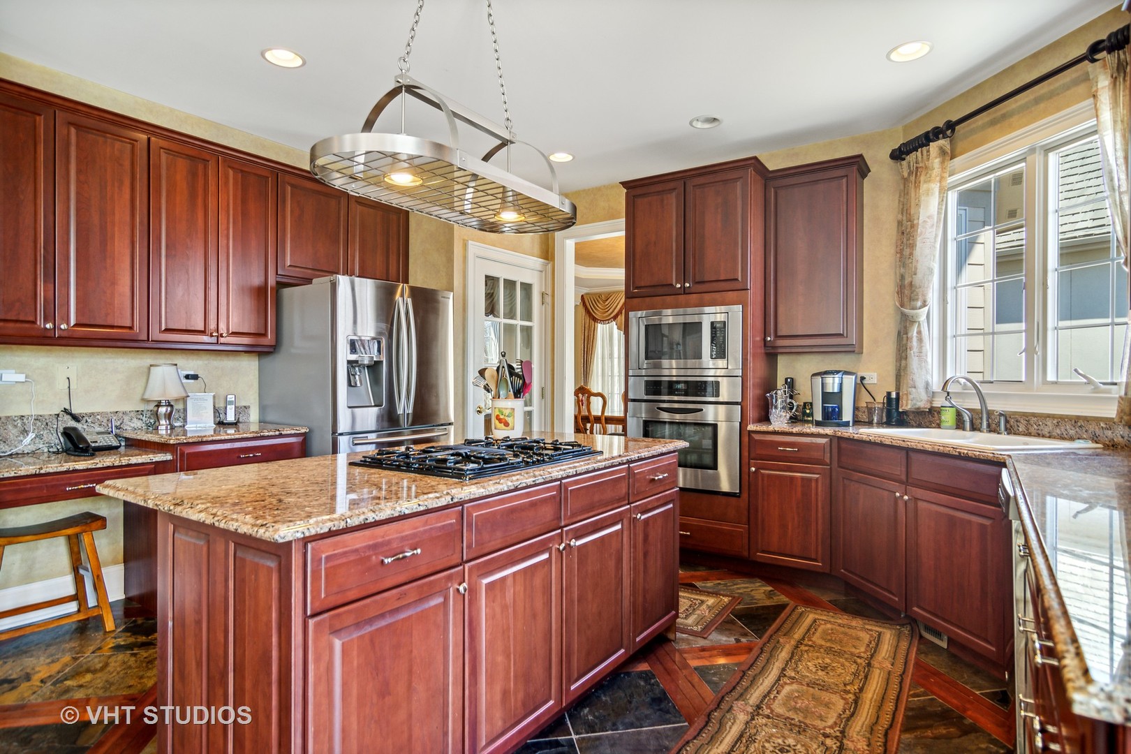 1015 Ridgeview Drive Inverness, IL 60010 - Photo 7 of 29 a kitchen with wooden cabinets and center island