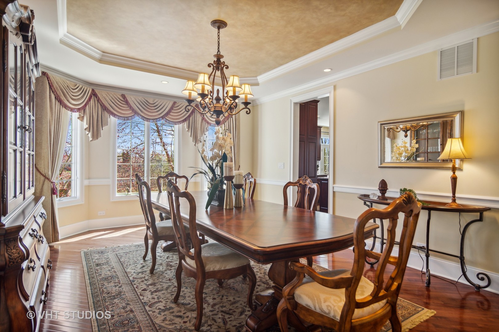 1015 Ridgeview Drive Inverness, IL 60010 - Photo 9 of 29 a view of a dining room with furniture a chandelier and wooden floor