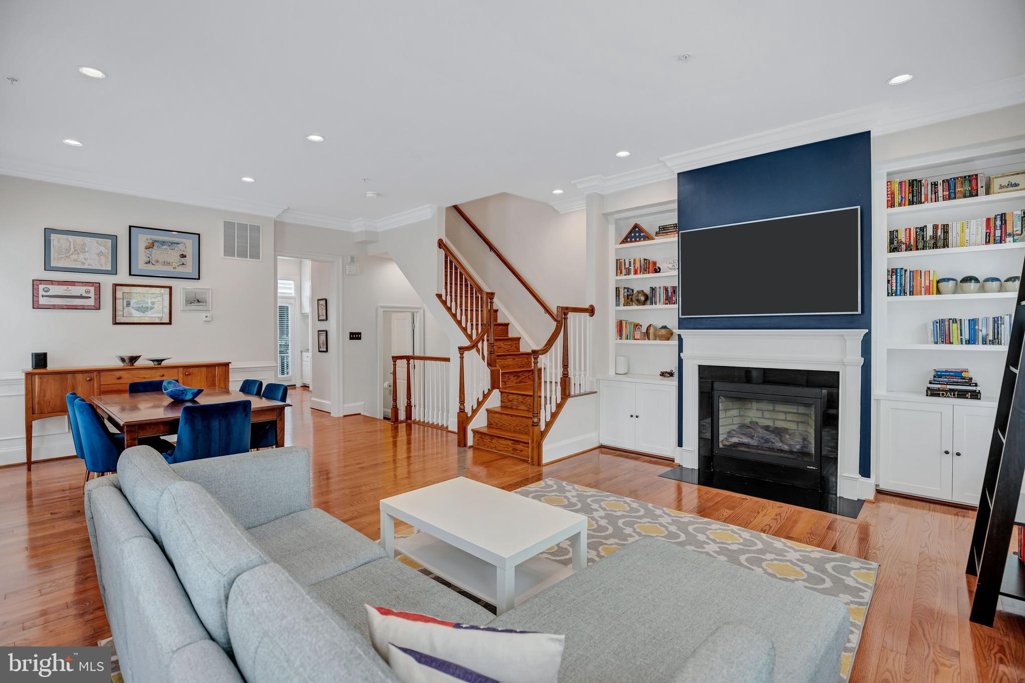 725 Carpenter Road Alexandria, VA 22314 - Photo 14 of 70 Custom Bookcases Flanking Gas Fireplace