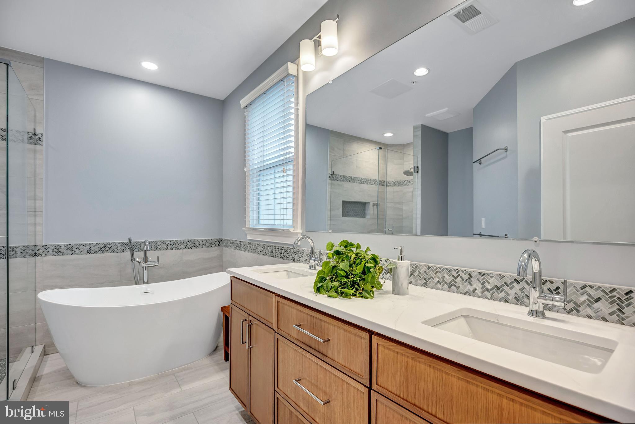 725 Carpenter Road Alexandria, VA 22314 - Photo 27 of 70 Quartz Countertop & Oak Vanity