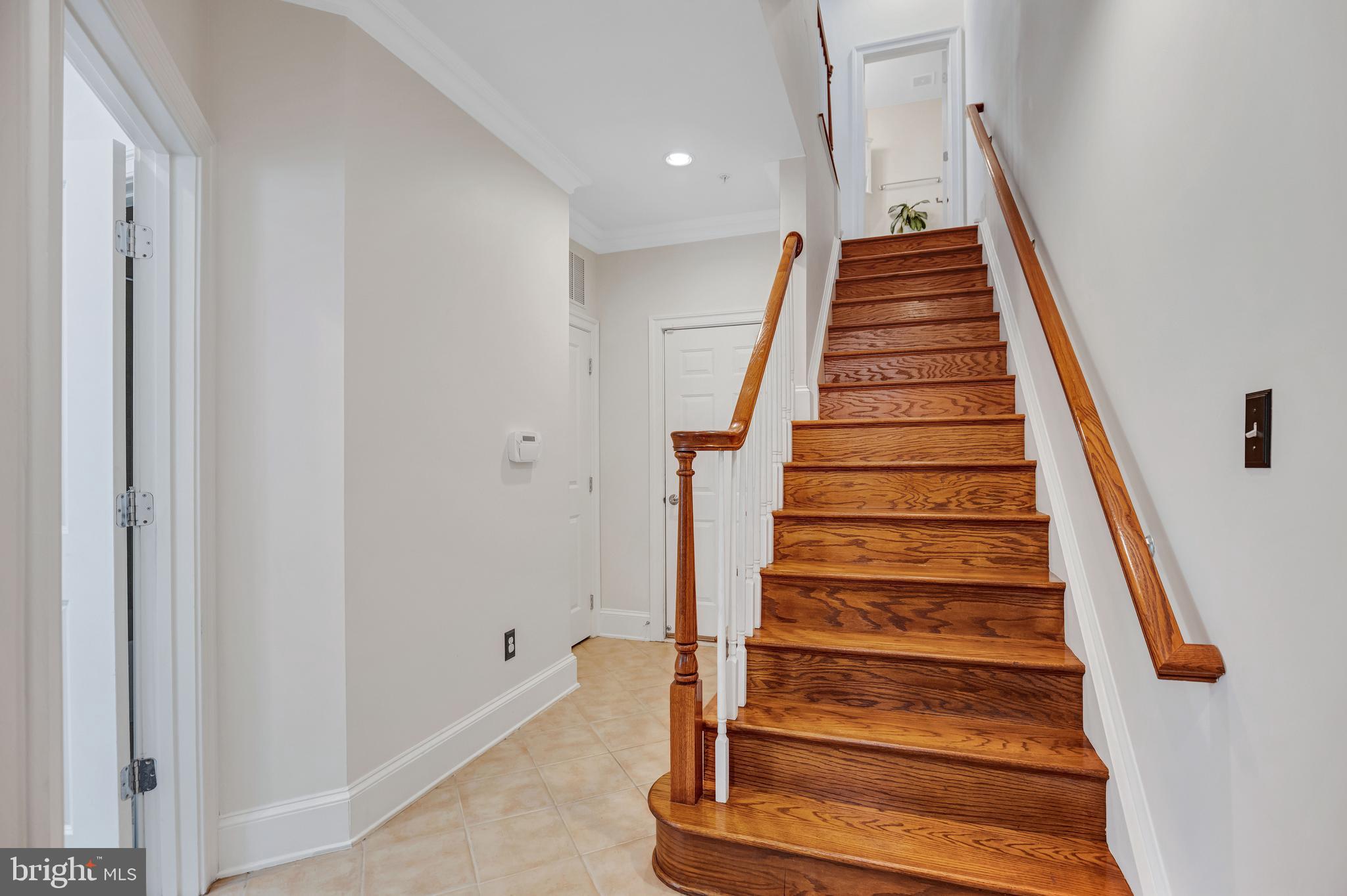 725 Carpenter Road Alexandria, VA 22314 - Photo 7 of 70 Oak Staircase Leads to Main Level