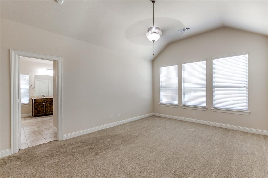 12618 Akenside Road Frisco, TX 75035 - Photo 14 of 31 Spare room with ceiling fan, vaulted ceiling, light carpet, and a healthy amount of sunlight