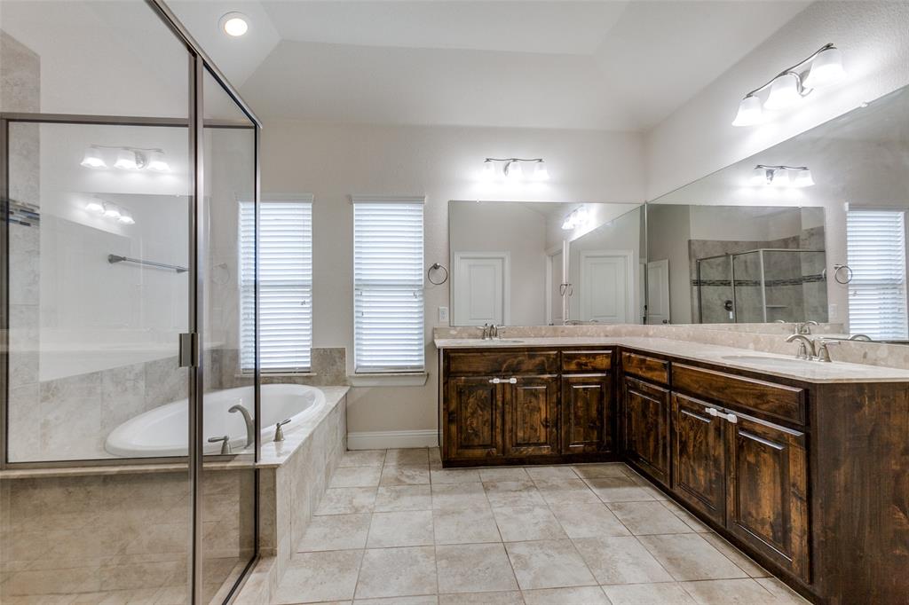 12618 Akenside Road Frisco, TX 75035 - Photo 15 of 31 Bathroom featuring tile patterned flooring, plenty of natural light, plus walk in shower, and dual vanity