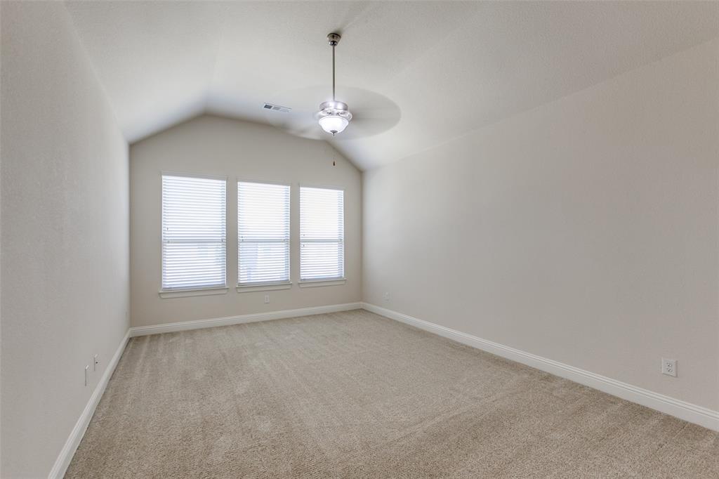 12618 Akenside Road Frisco, TX 75035 - Photo 23 of 31 Unfurnished room with ceiling fan, light carpet, and lofted ceiling