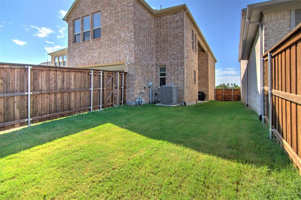 12618 Akenside Road Frisco, TX 75035 - Photo 27 of 31 View of yard featuring central air condition unit