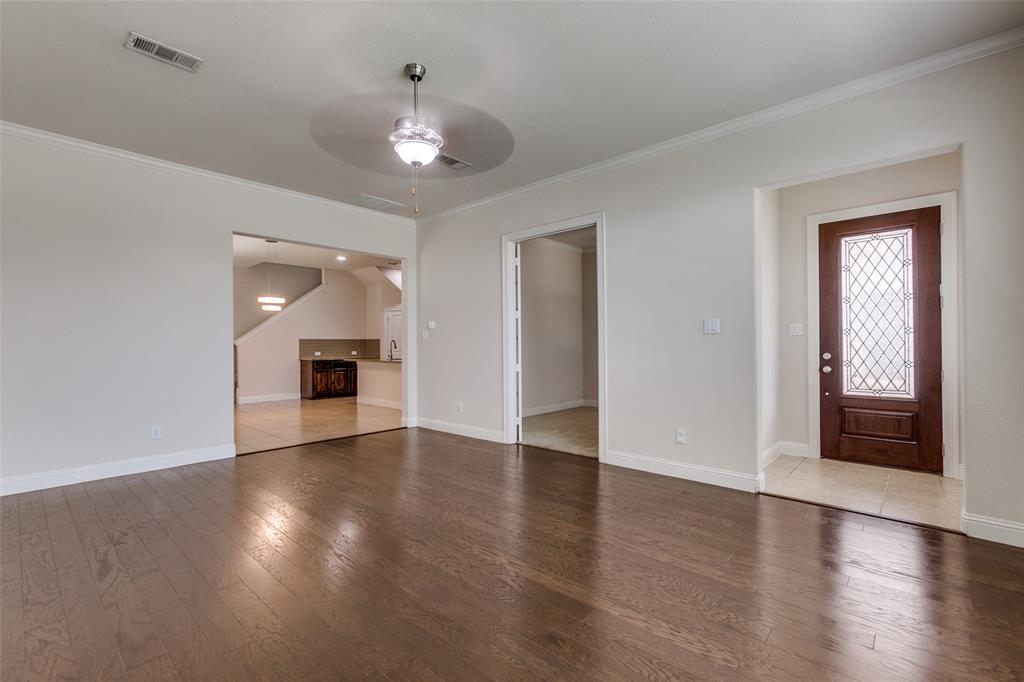 12618 Akenside Road Frisco, TX 75035 - Photo 2 of 31 Tiled entrance foyer featuring ceiling fan, sink, and ornamental molding