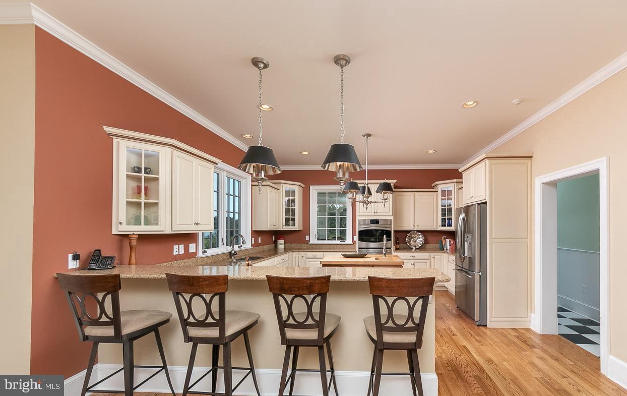 5547 Whitehall Road Cambridge, MD 21613 - Photo 18 of 60 Large Breakfast Bar, with Hudson Valley Lighting