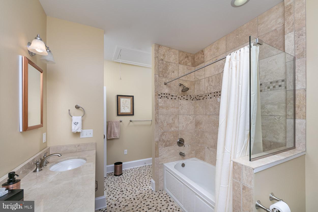 5547 Whitehall Road Cambridge, MD 21613 - Photo 37 of 60 Jack and Jill Bathroom with Custom Tile