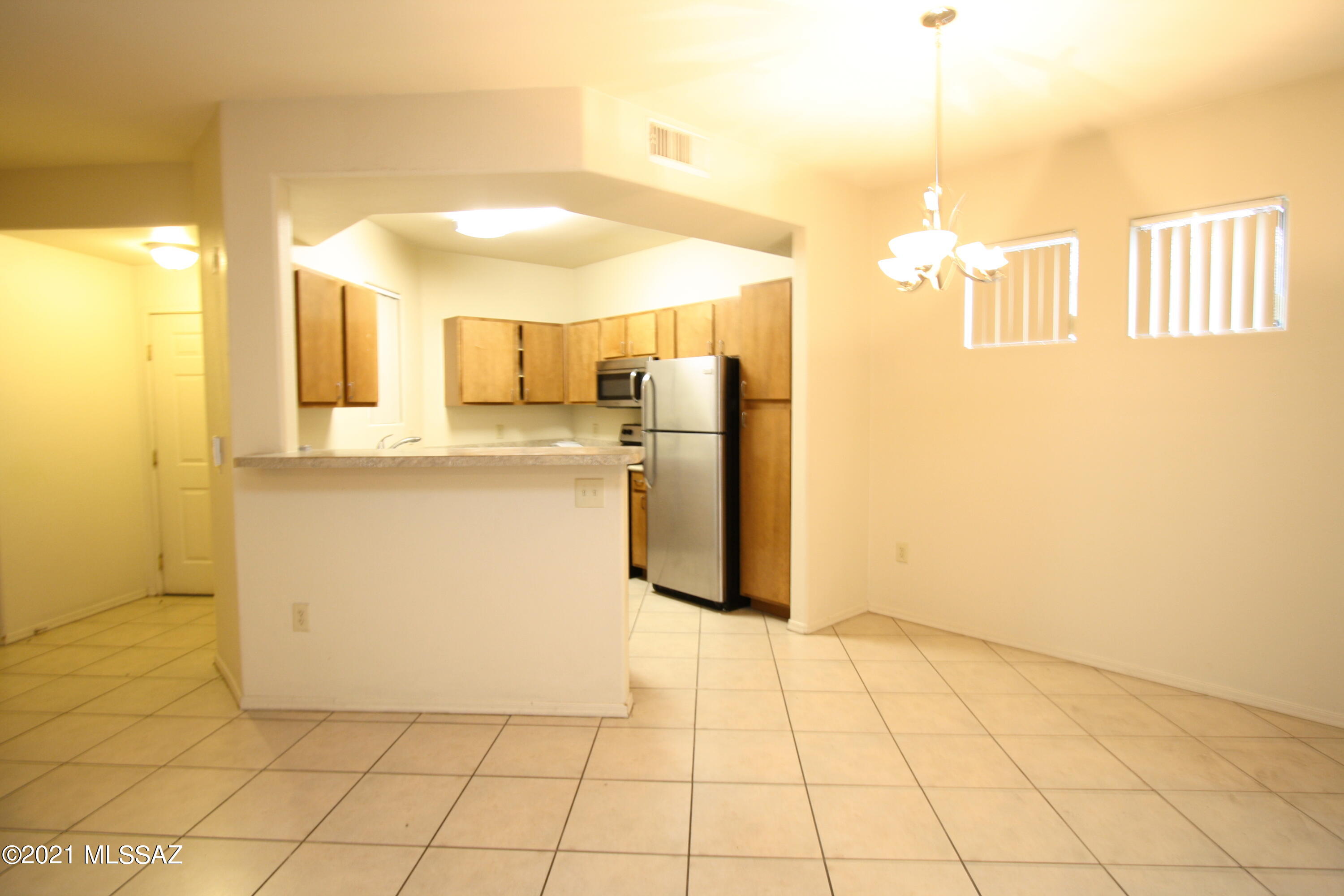 2550 East River Road, Unit 5104 Tucson, AZ 85718 - Photo 5 of 14 a view of a kitchen with a sink