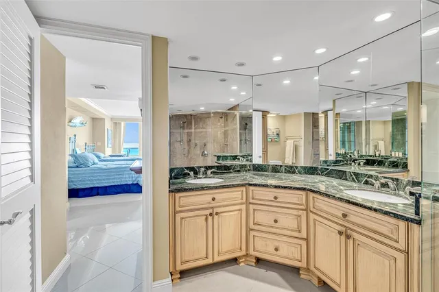 a large kitchen with granite countertop a lot of counter space and wooden floor
