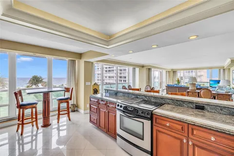 a kitchen with stainless steel appliances granite countertop a stove and a sink