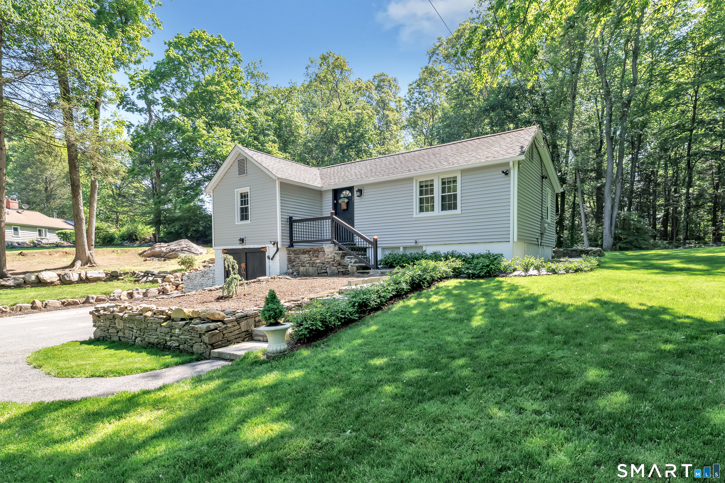 57 Olmstead Road Redding, CT 06896 - Photo 2 of 22 a view of a house with backyard and sitting area