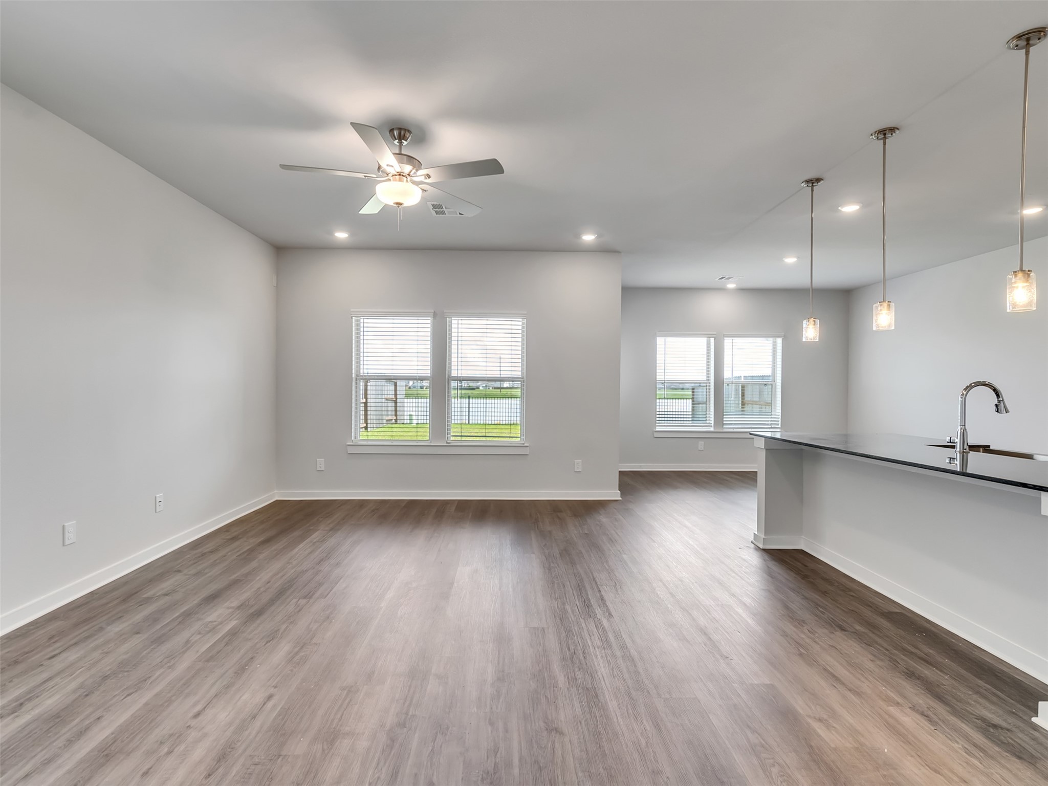 1206 Elsinore Drive Rosharon, TX 77583 - Photo 3 of 21 wooden floor in an empty room with a window