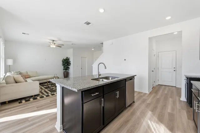 a kitchen with a sink and cabinets