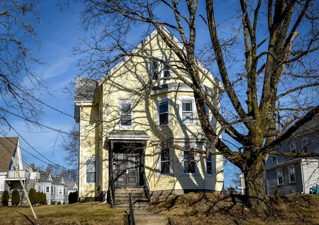 a view of a building with a tree