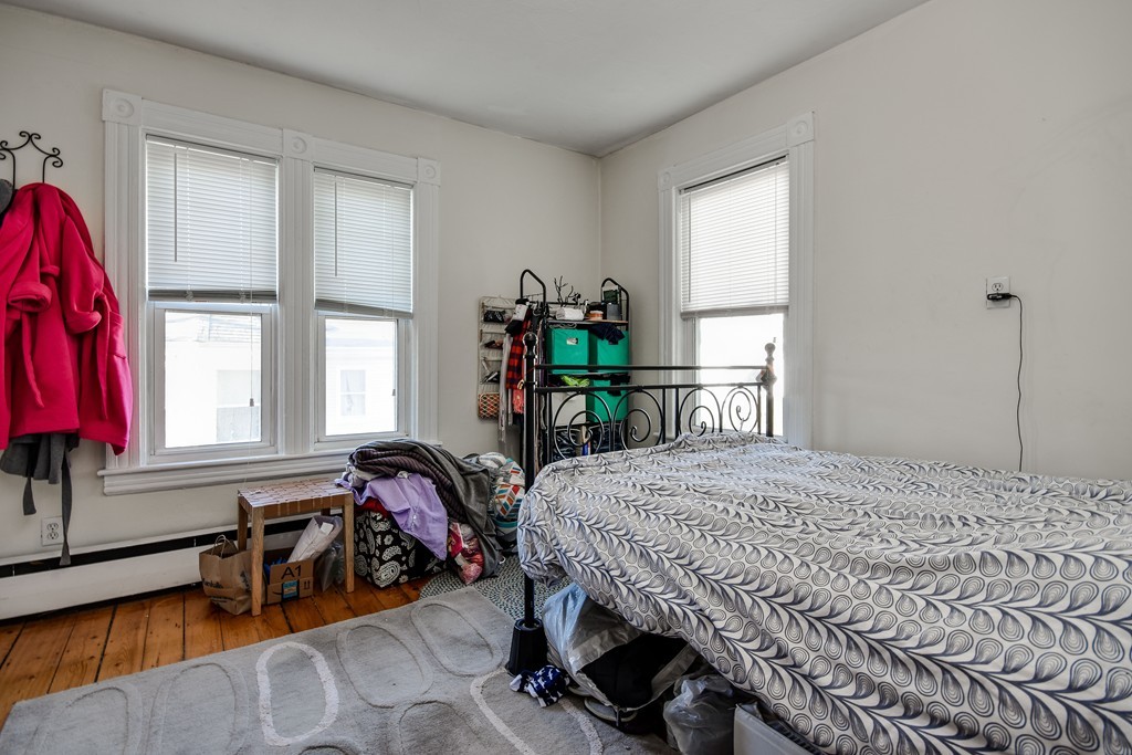 25 North Main Street Natick, MA 01760 - Photo 12 of 16 a bedroom with a bed and a large window