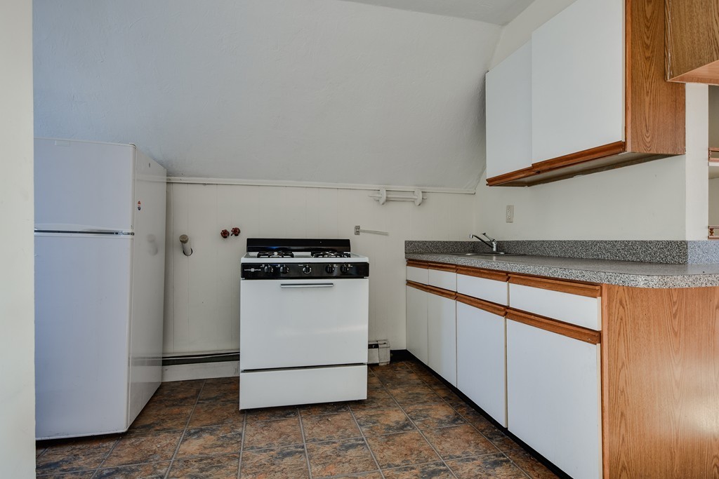 25 North Main Street Natick, MA 01760 - Photo 16 of 16 a kitchen with a refrigerator and a sink