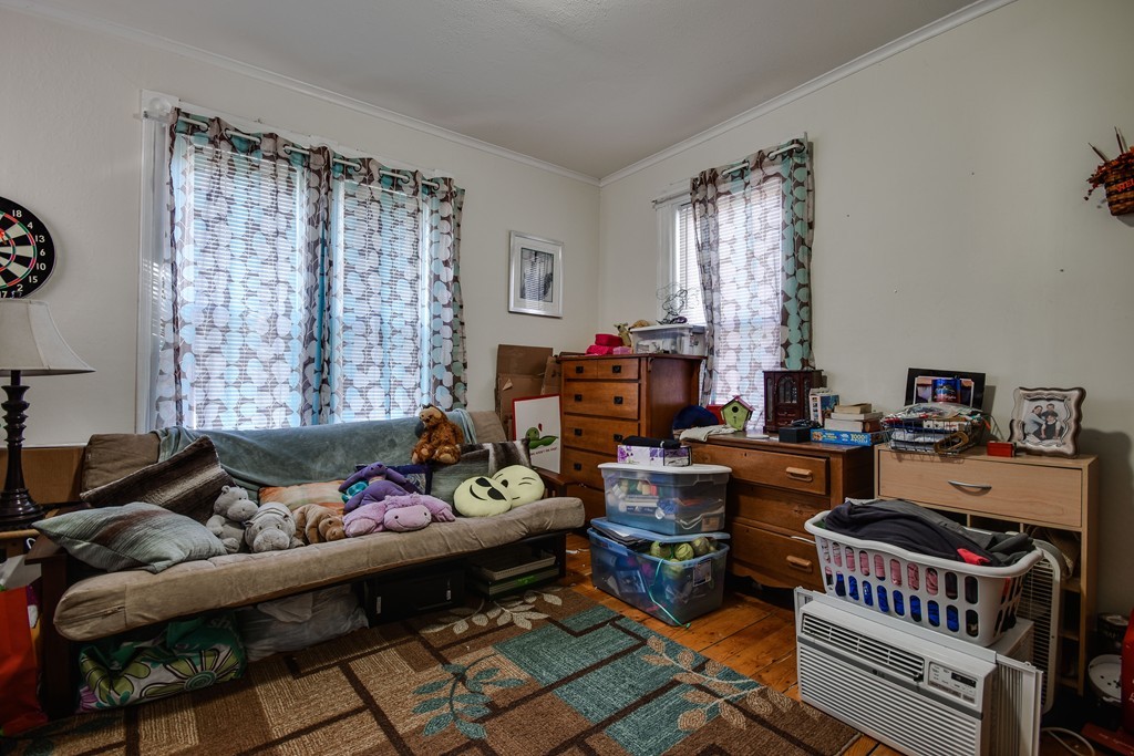 25 North Main Street Natick, MA 01760 - Photo 3 of 16 a living room with furniture and a window