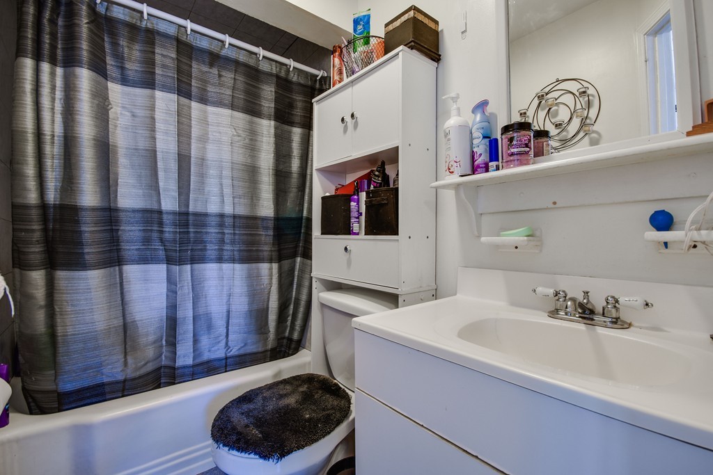 25 North Main Street Natick, MA 01760 - Photo 5 of 16 a bathroom with a sink and a mirror