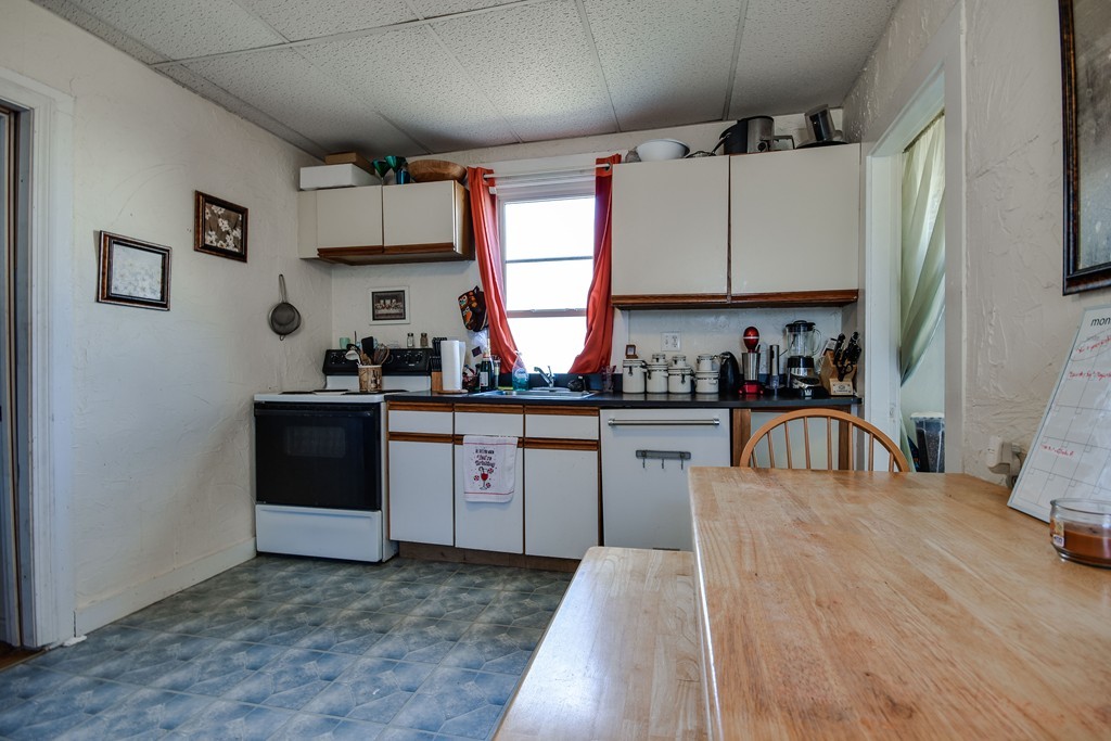 25 North Main Street Natick, MA 01760 - Photo 6 of 16 a kitchen with a sink a window and cabinets