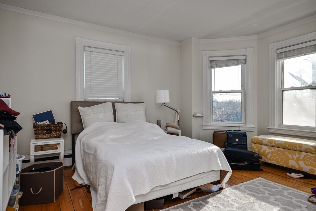 25 North Main Street Natick, MA 01760 - Photo 8 of 16 a bedroom with a bed and a window