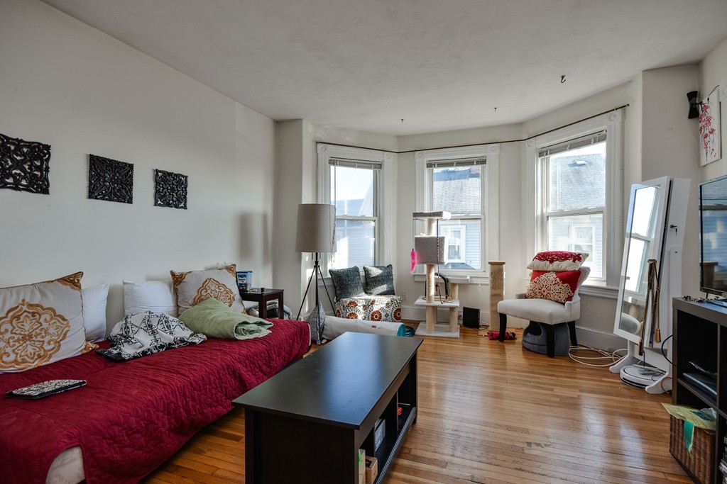 25 North Main Street Natick, MA 01760 - Photo 9 of 16 a living room with furniture window and wooden floor
