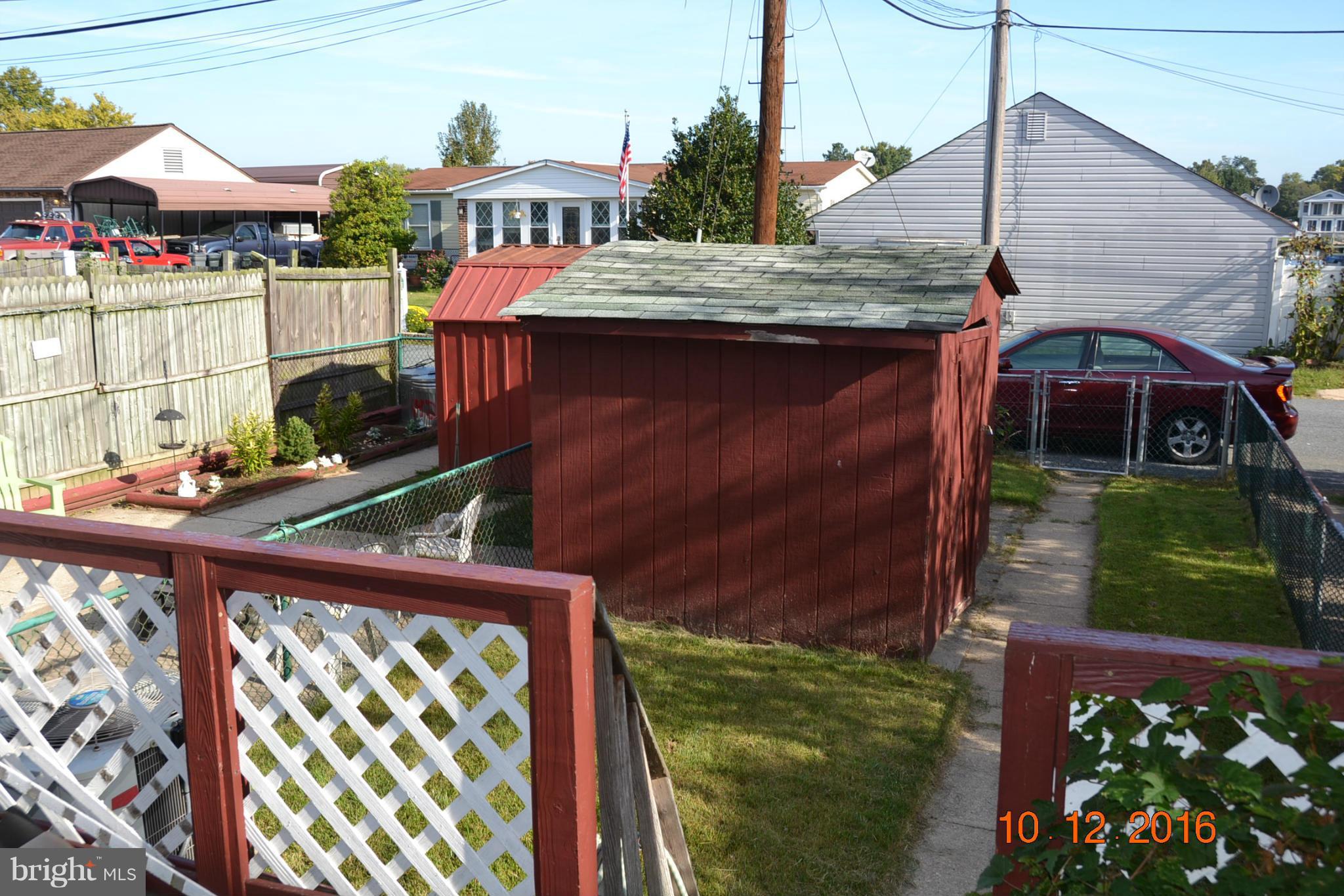 8544 Kavanagh Road Baltimore, MD 21222 - Photo 3 of 14 a front view of a house with garden