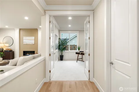a living room with furniture and a large mirror