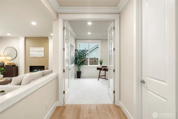a living room with furniture and a large mirror