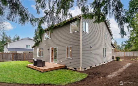 a front view of house with a garden and patio