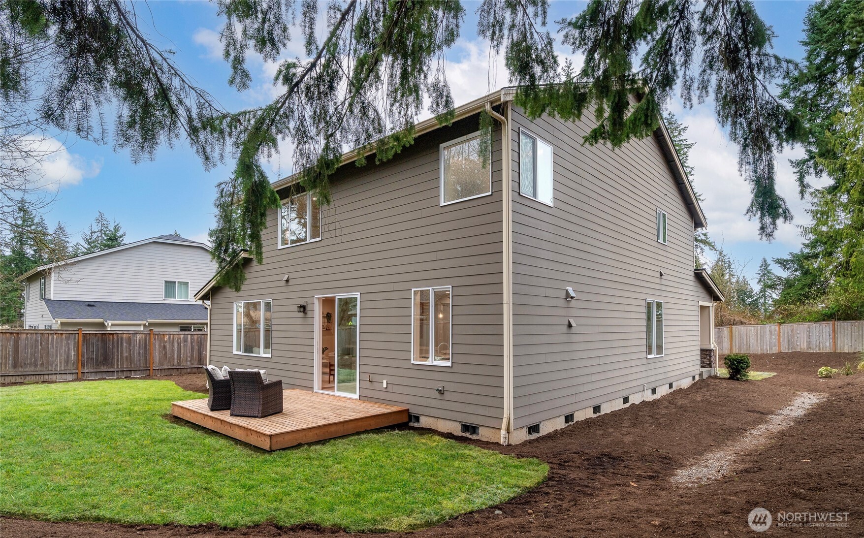 24026 Meridian Avenue South Bothell, WA 98021 - Photo 26 of 30 a front view of house with a garden and patio