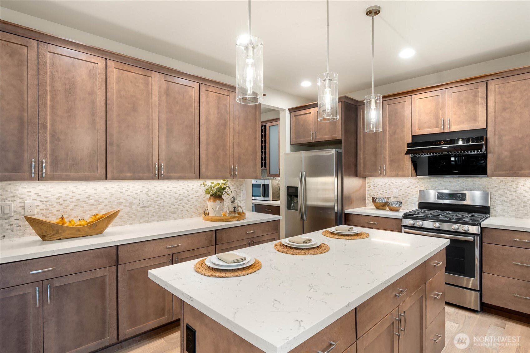 24026 Meridian Avenue South Bothell, WA 98021 - Photo 10 of 30 a kitchen with a sink a stove and chairs