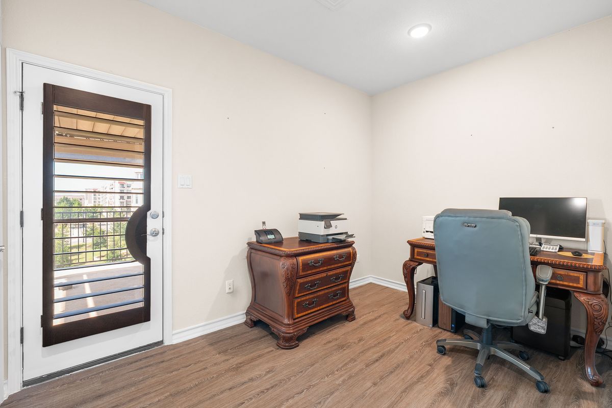 1116 Highknoll Lane Georgetown, TX 78628 - Photo 32 of 36 a view of a workspace with furniture and a window