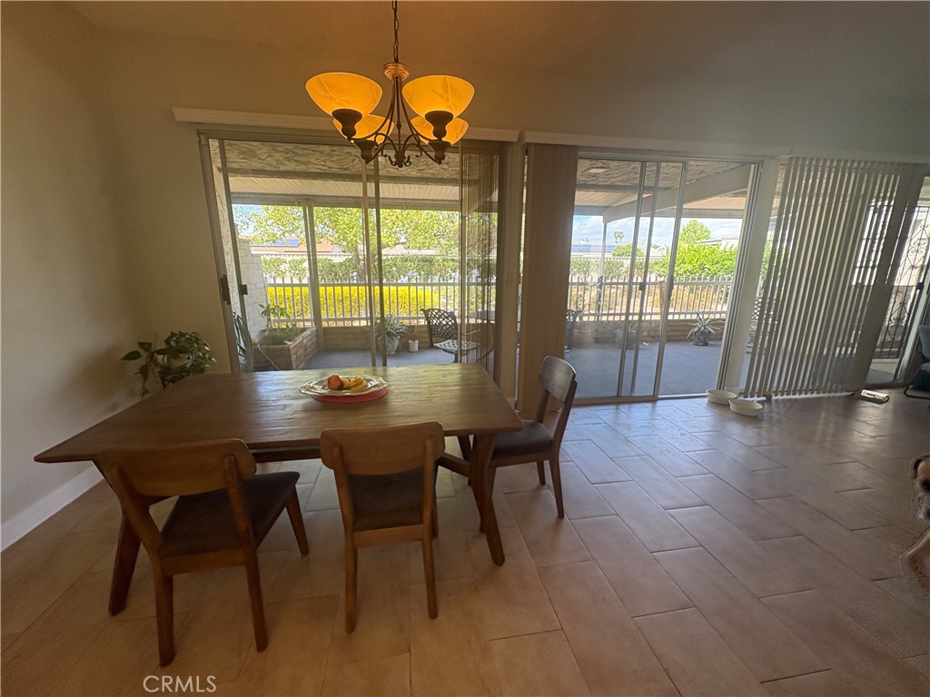 26168 Birkdale Road Menifee, CA 92586 - Photo 8 of 15 a view of a dining room with furniture window and outside view