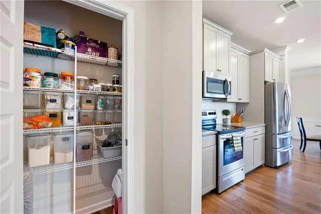 a white toilet sitting next to a bathroom sink