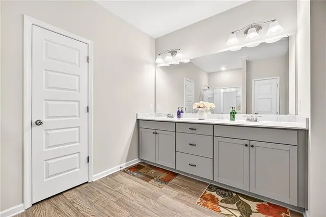a bathroom with a glass shower door